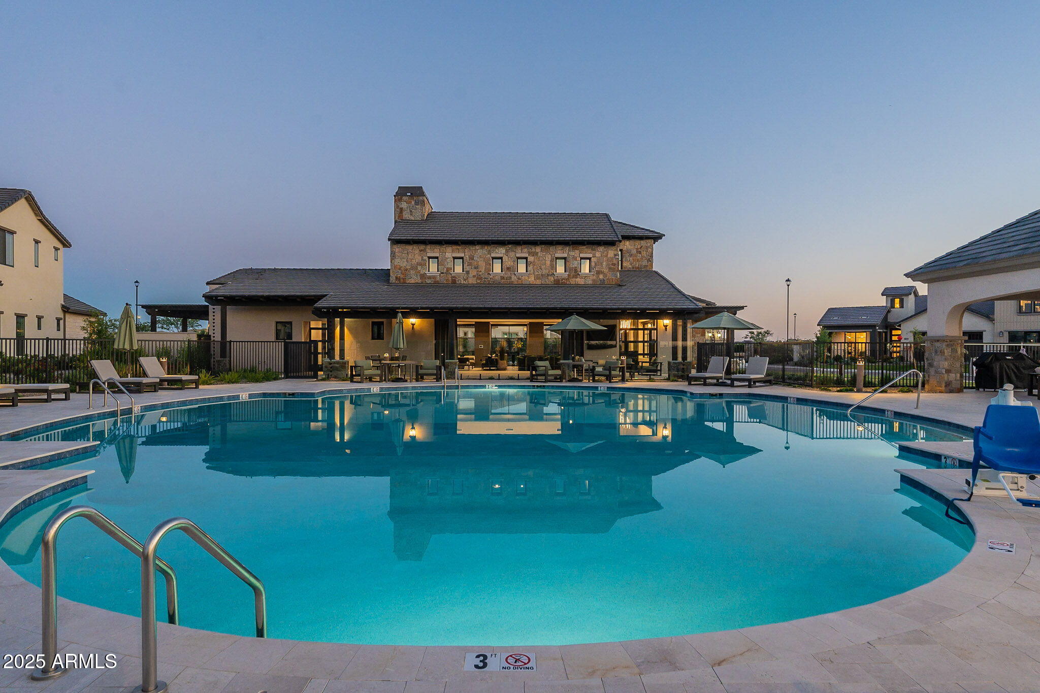 3326 South Stuart Court Gilbert, AZ 85297 - Photo 82 of 88 a view of a swimming pool with chairs
