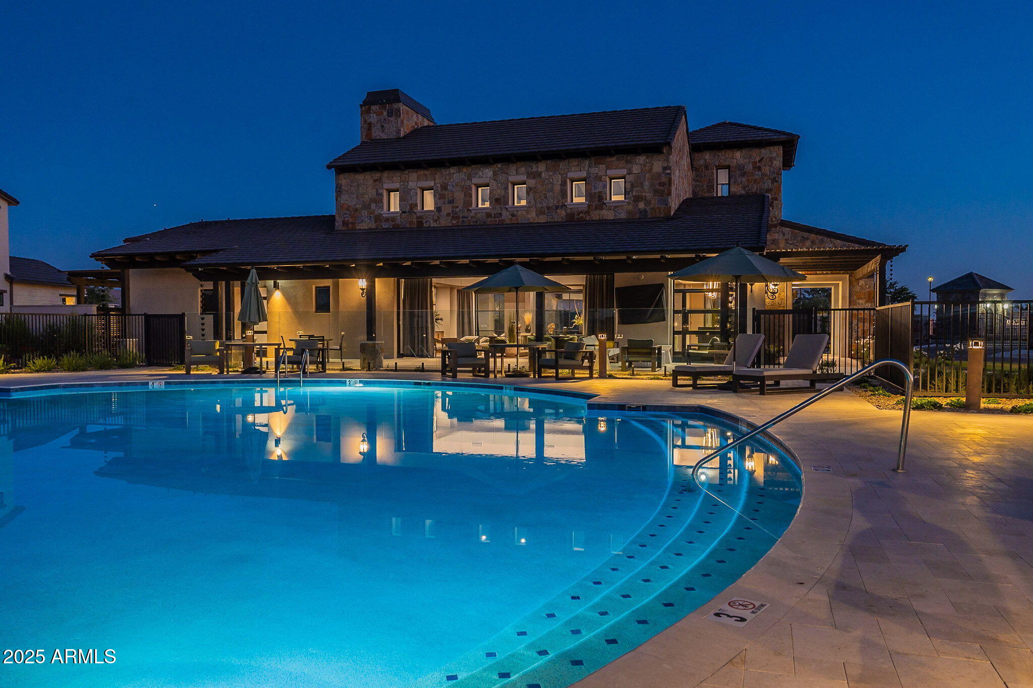 3326 South Stuart Court Gilbert, AZ 85297 - Photo 87 of 88 a view of a swimming pool with outdoor seating