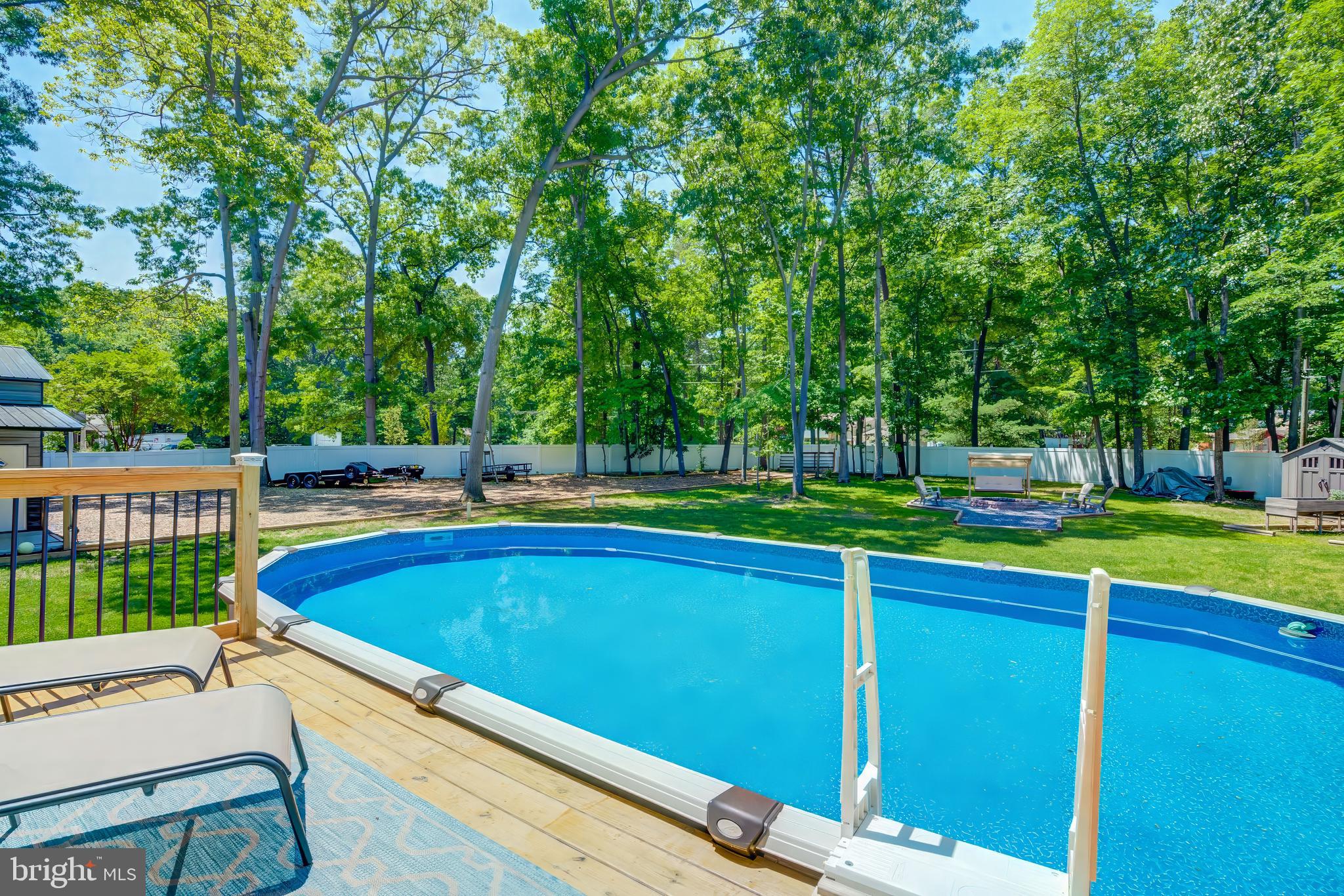 8331 Woodland Road Pasadena, MD 21122 - Photo 46 of 63 Above Ground pool with Deck