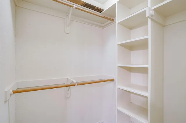 a view of an empty walk in closet