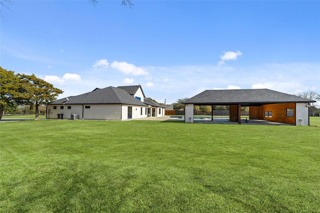 5020 Montgomery Road Midlothian, TX 76065 - Photo 38 of 40 Rear view of house featuring a patio and a lawn