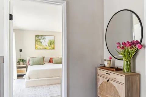 a living room with furniture flowerpot and a potted plant