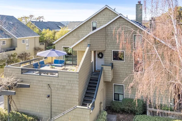 a view of a house with iron stairs