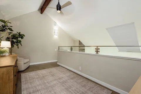 a view of storage and utility room with a window