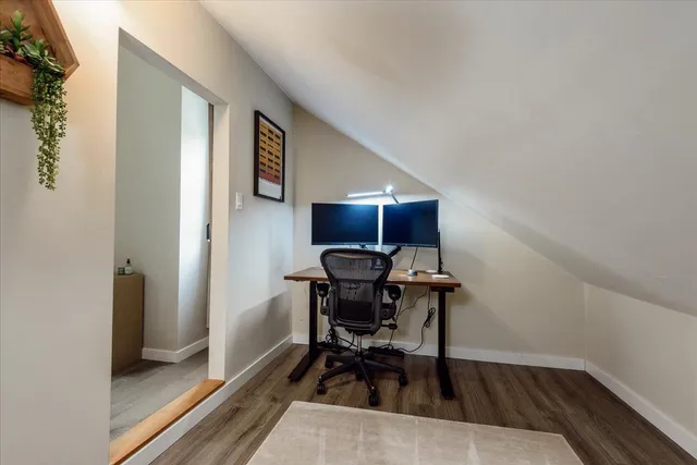 a workspace with furniture and wooden floor