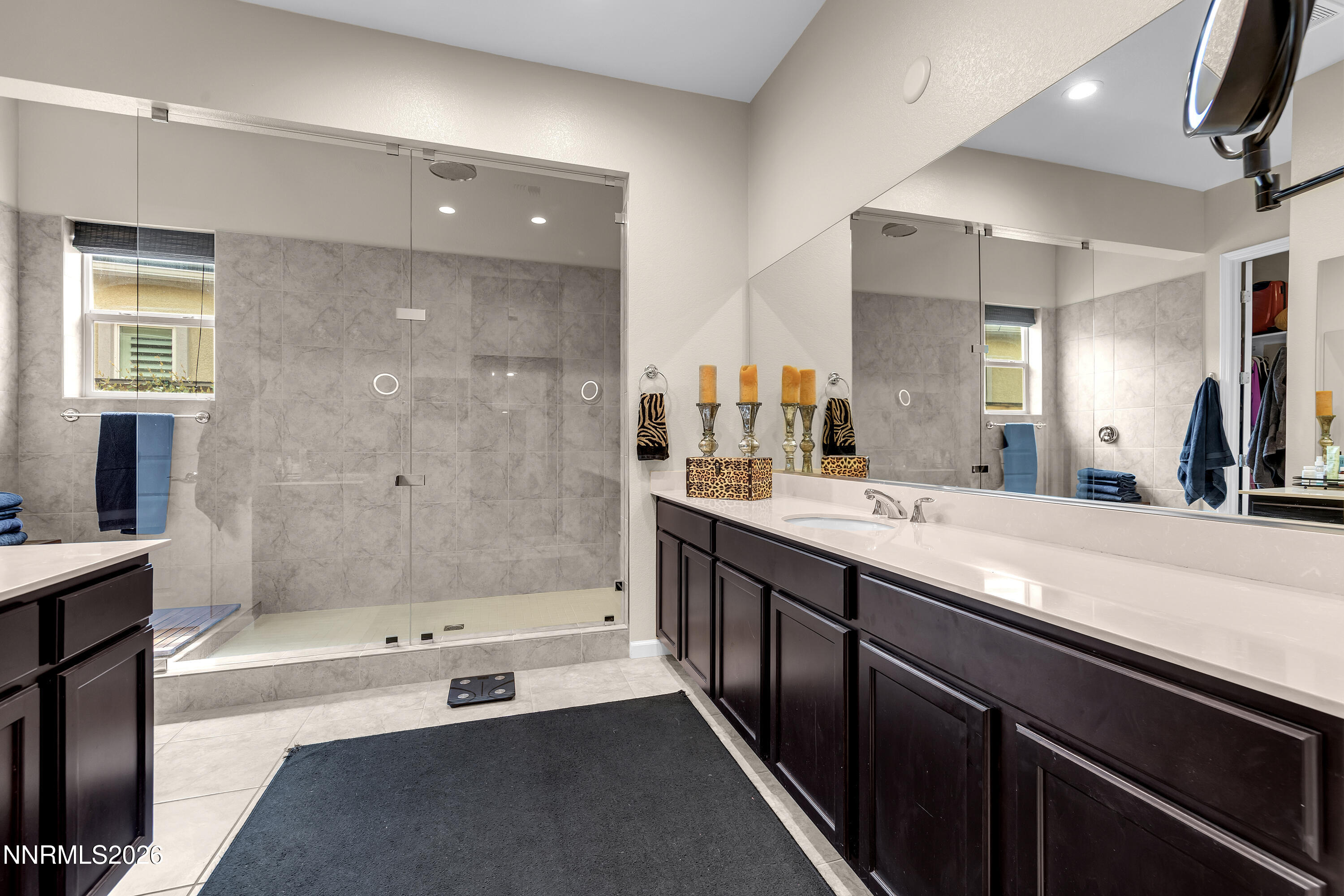 9021 Iron Sky Court Reno, NV 89523 - Photo 25 of 39 a spacious bathroom with a bathtub sink and mirror