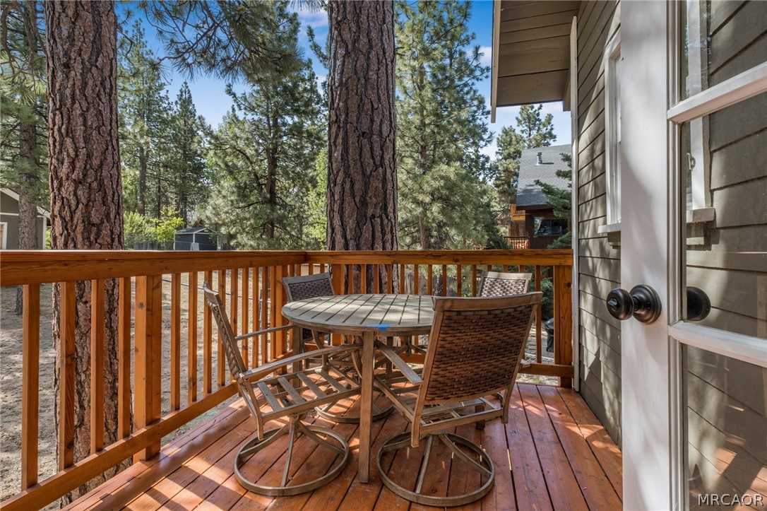 195 Elgin Road Big Bear Lake, CA 92315 - Photo 25 of 45 a view of a chairs and table in the balcony