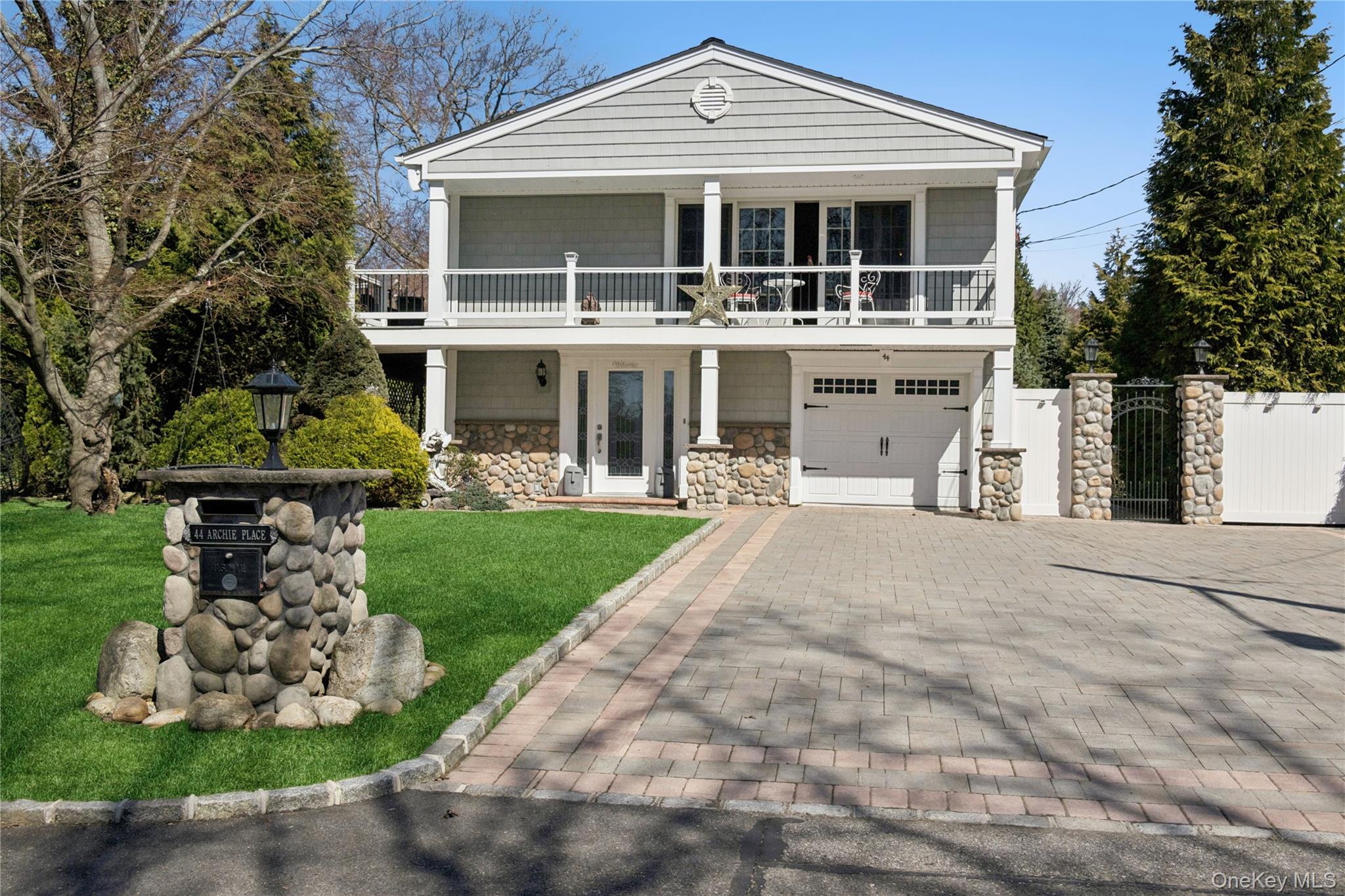 44 Archie Place West Islip, NY 11795 - Photo 1 of 36 a front view of a house with a yard and potted plants