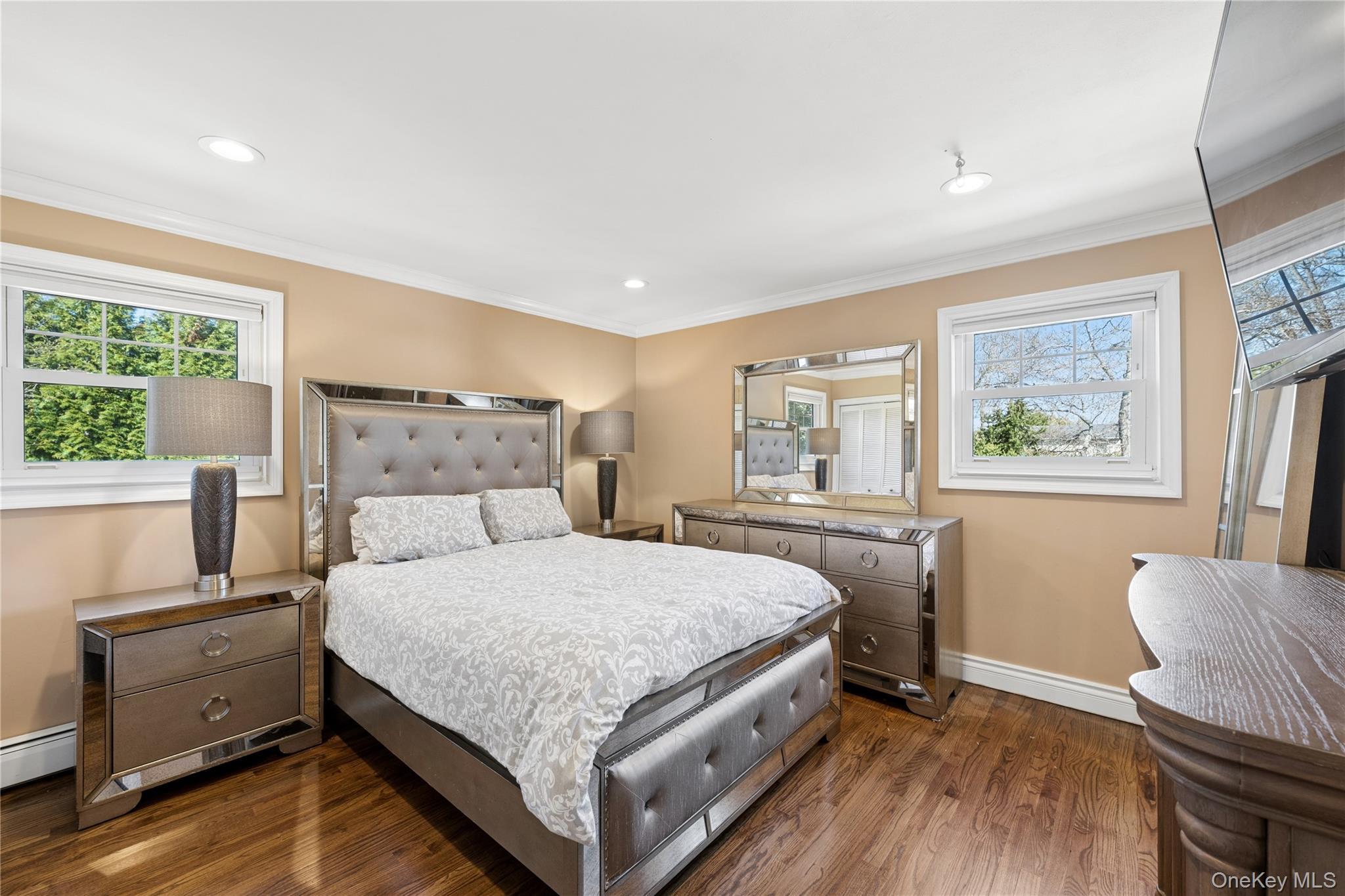 44 Archie Place West Islip, NY 11795 - Photo 11 of 36 a bedroom with a bed and wooden floor