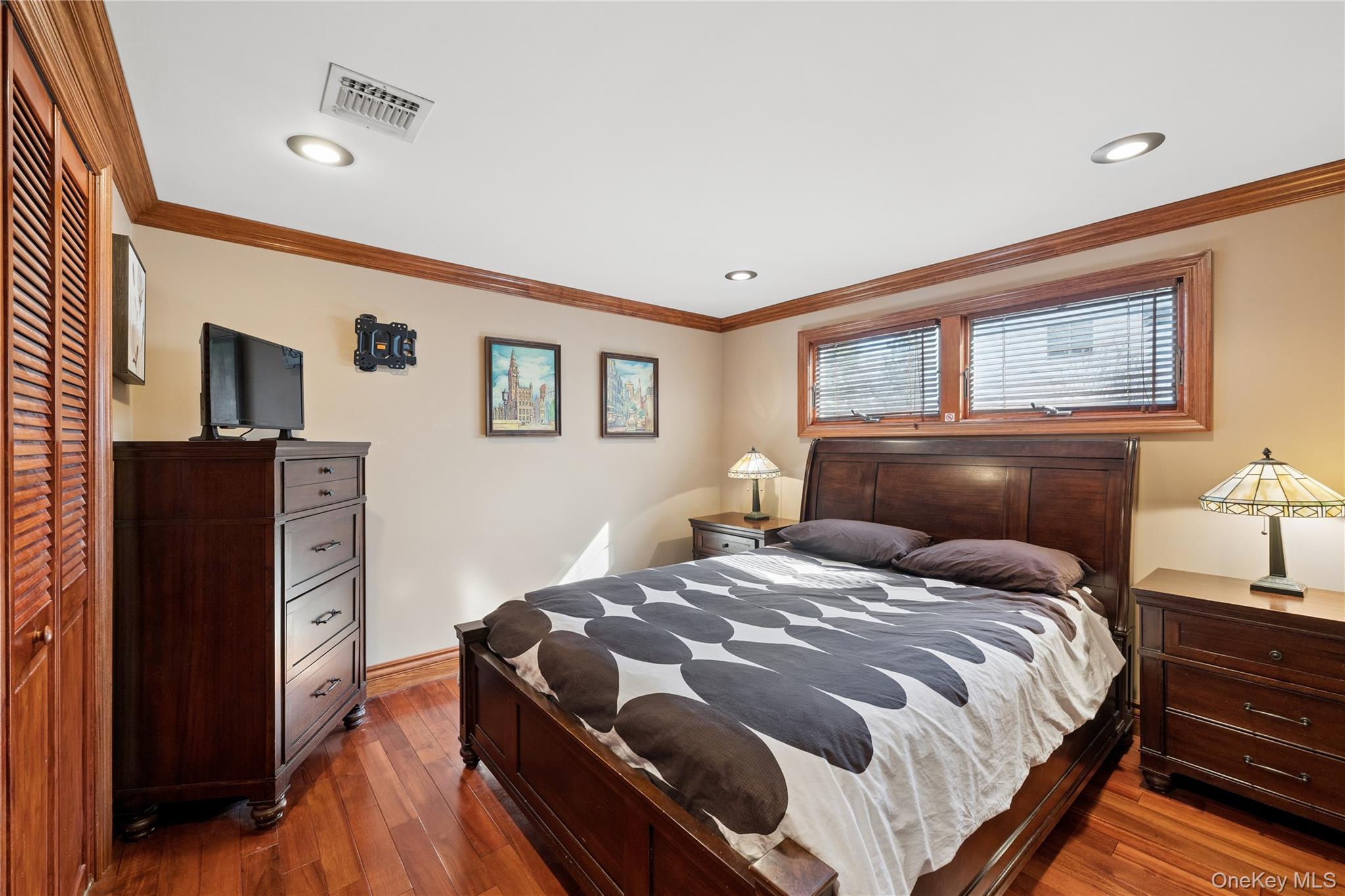 44 Archie Place West Islip, NY 11795 - Photo 15 of 36 a bedroom with a bed and wooden floor