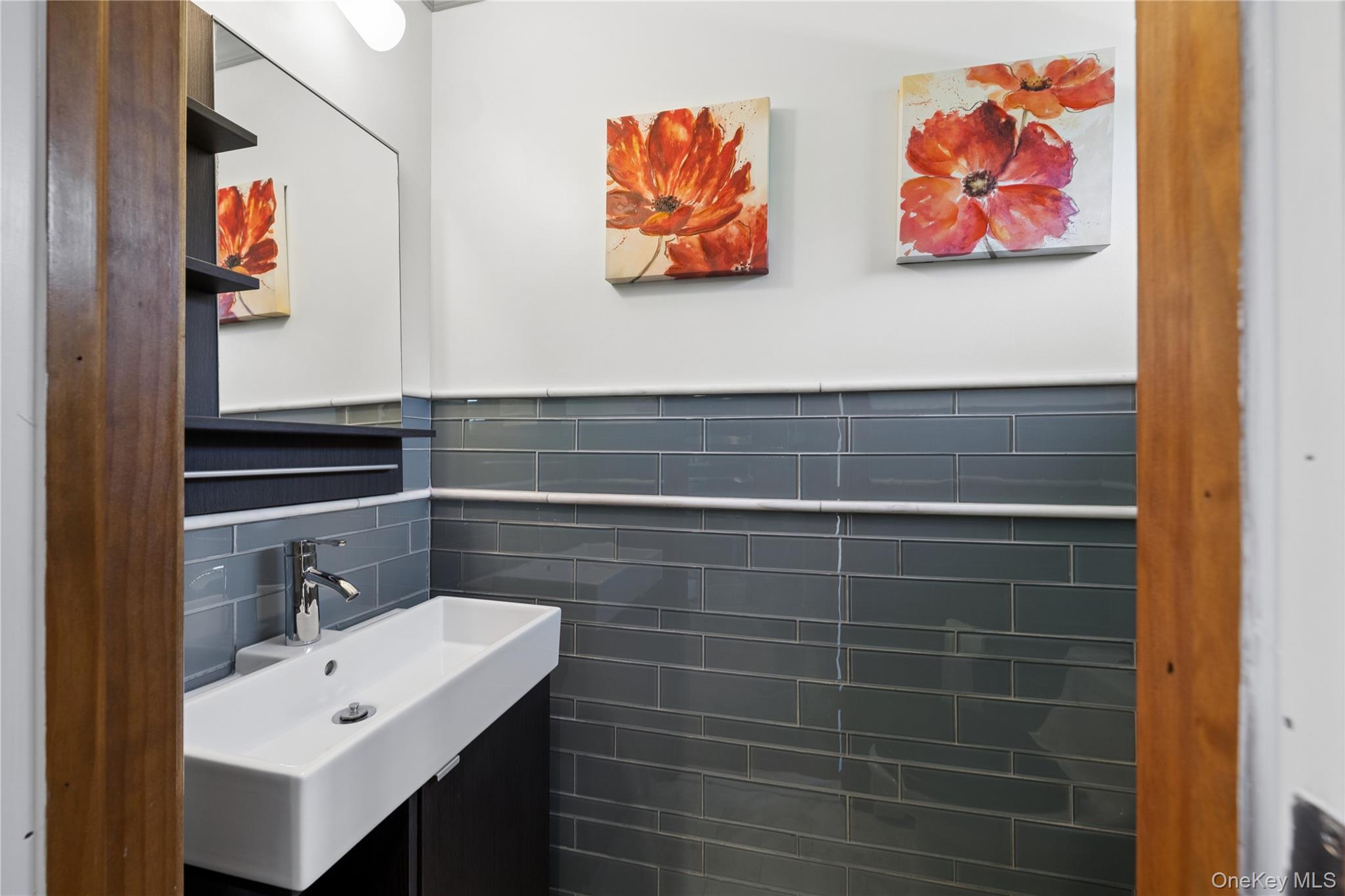 44 Archie Place West Islip, NY 11795 - Photo 16 of 36 a bathroom with a sink and a mirror