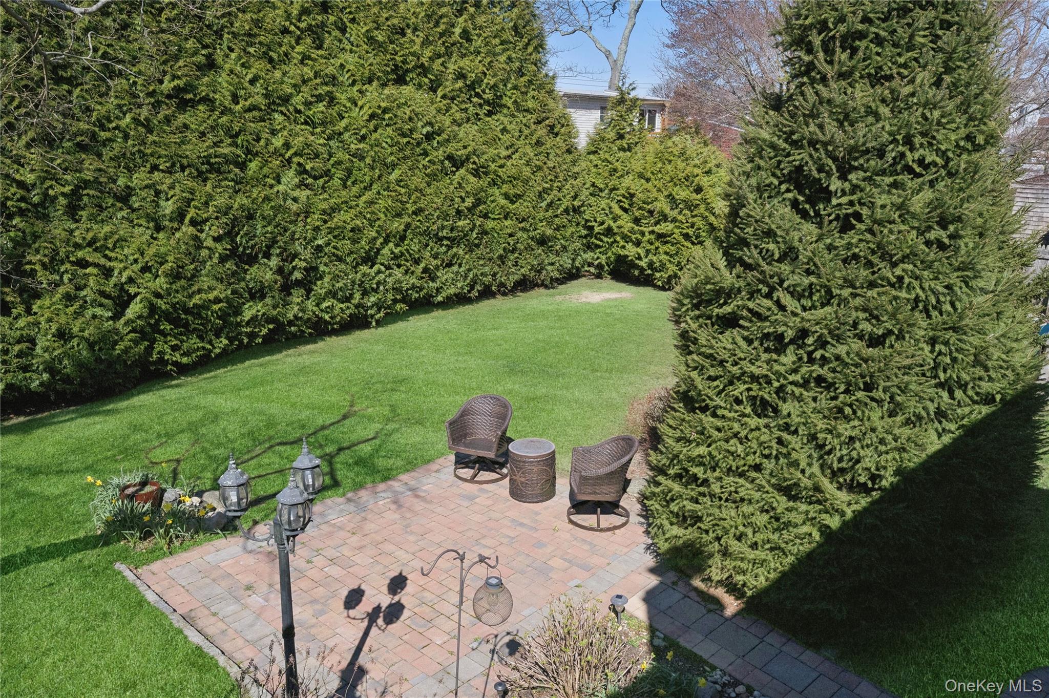 44 Archie Place West Islip, NY 11795 - Photo 22 of 36 a view of a backyard with sitting area