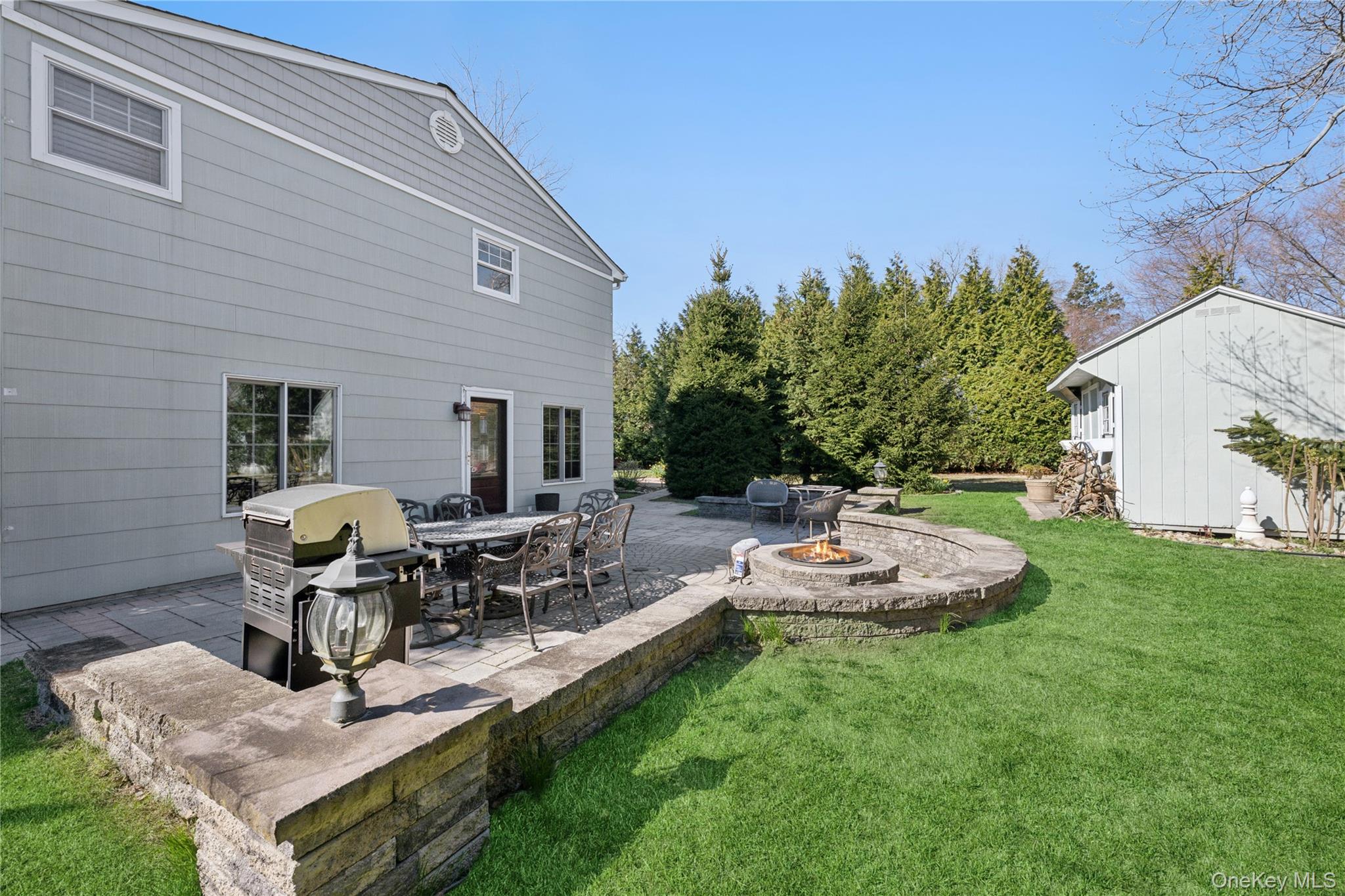 44 Archie Place West Islip, NY 11795 - Photo 25 of 36 a view of a backyard with plants and patio