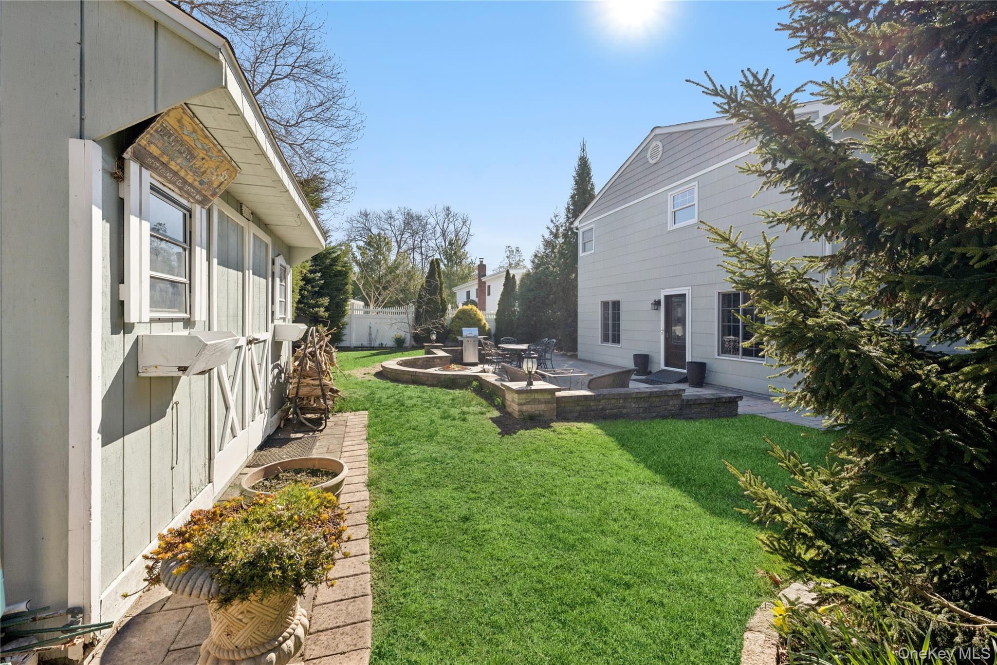 44 Archie Place West Islip, NY 11795 - Photo 26 of 36 a view of a house with backyard porch and sitting area