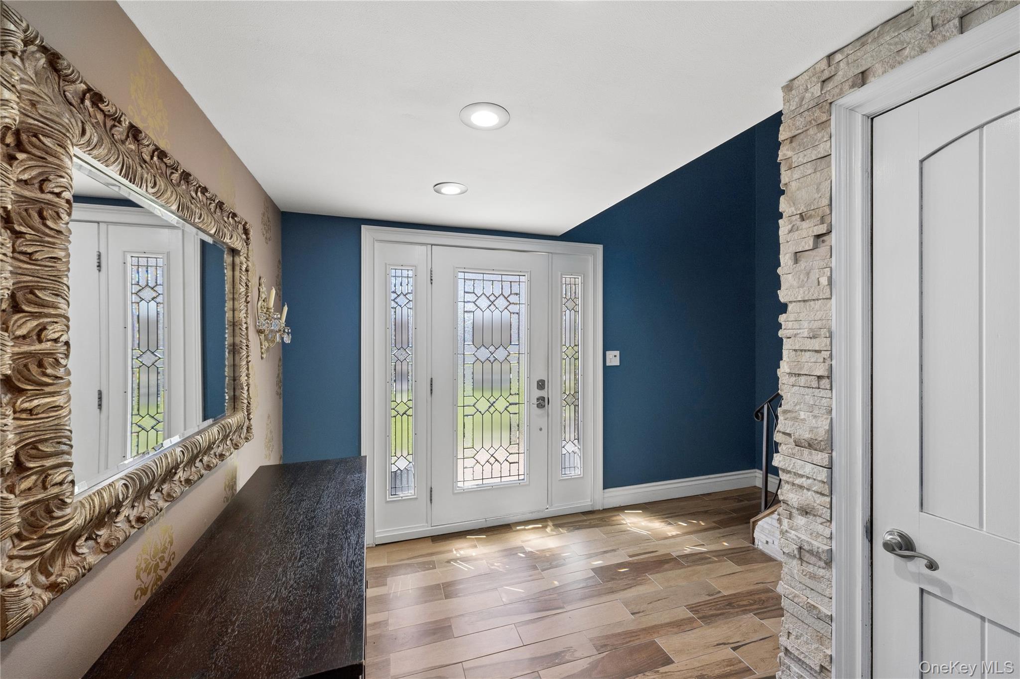 44 Archie Place West Islip, NY 11795 - Photo 4 of 36 a view of an entryway with wooden floor and door