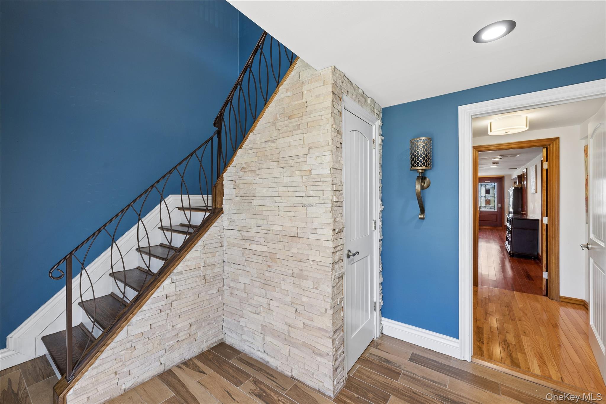 44 Archie Place West Islip, NY 11795 - Photo 5 of 36 a view of a hallway with wooden floor and staircase