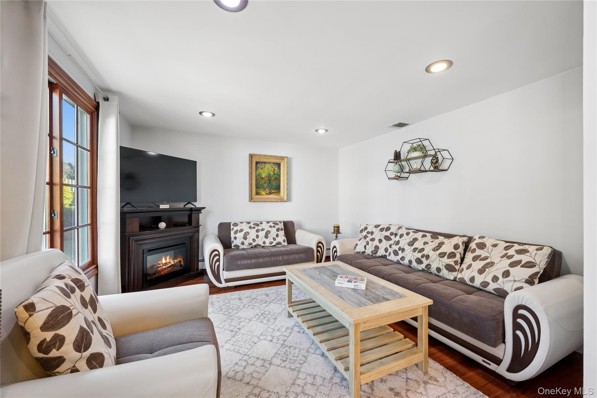 44 Archie Place West Islip, NY 11795 - Photo 6 of 36 a living room with furniture and a couch