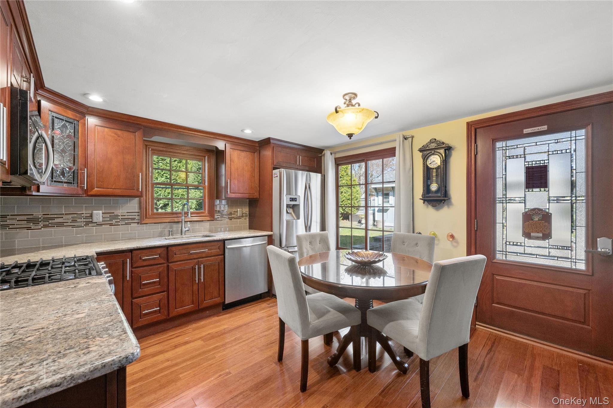 44 Archie Place West Islip, NY 11795 - Photo 7 of 36 a view of a dining room with furniture and wooden floor
