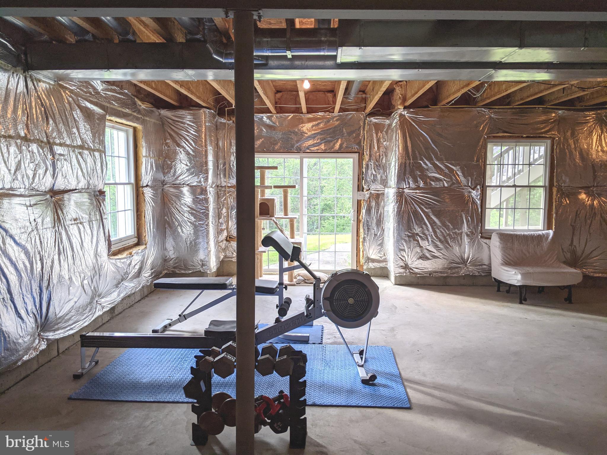 107 Sloan Road West Chester, PA 19382 - Photo 28 of 34 Basement with windows and slider to back yard