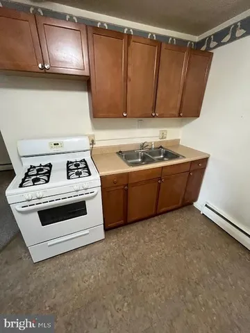 a view of cabinets and window in a kitchen