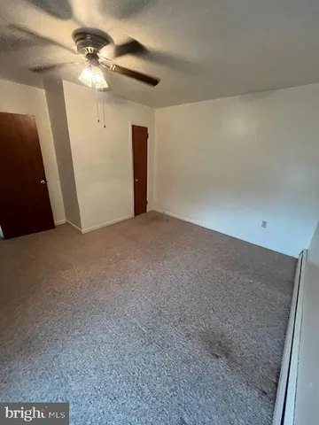 a view of a livingroom with a ceiling fan