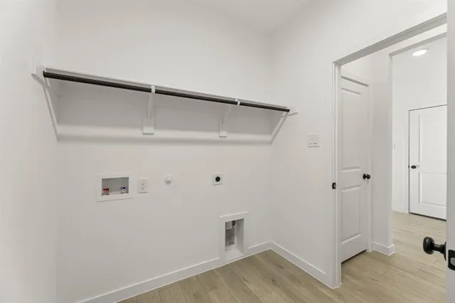 a view of an entryway with wooden floor