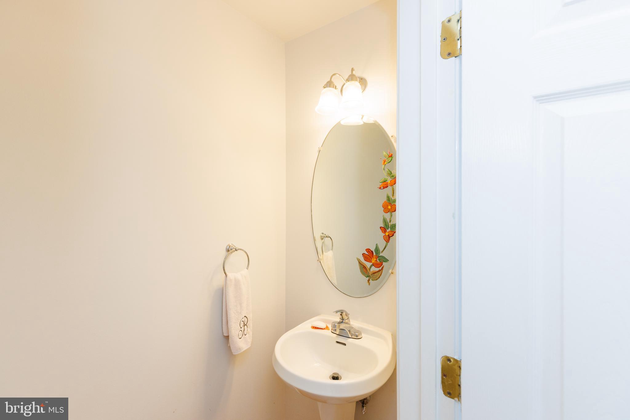 232 Night Haven Court Edgewater, MD 21037 - Photo 11 of 39 a bathroom with a sink and mirror
