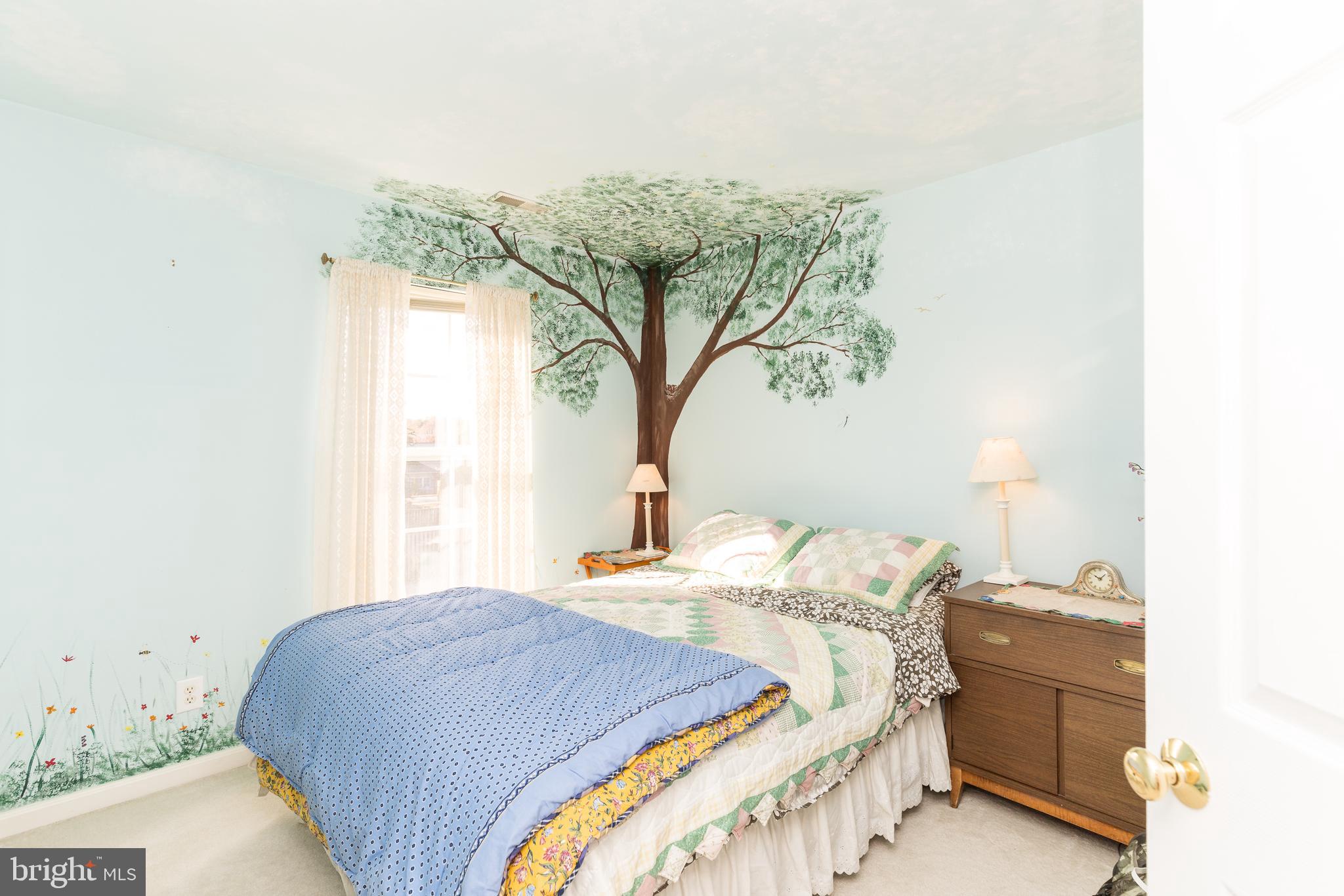 232 Night Haven Court Edgewater, MD 21037 - Photo 16 of 39 a bedroom with a bed and a chandelier