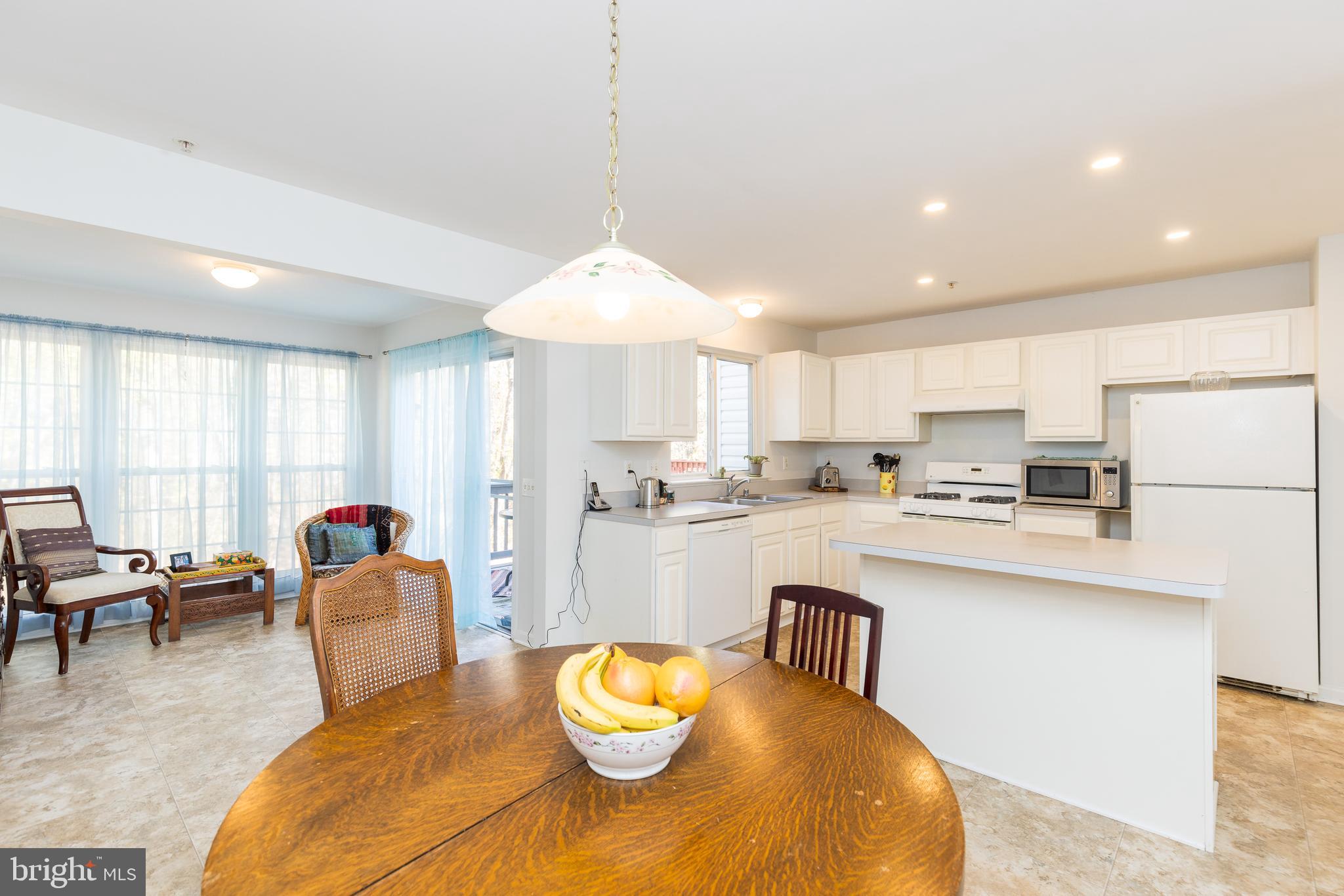 232 Night Haven Court Edgewater, MD 21037 - Photo 2 of 39 a large kitchen with a table and chairs in it