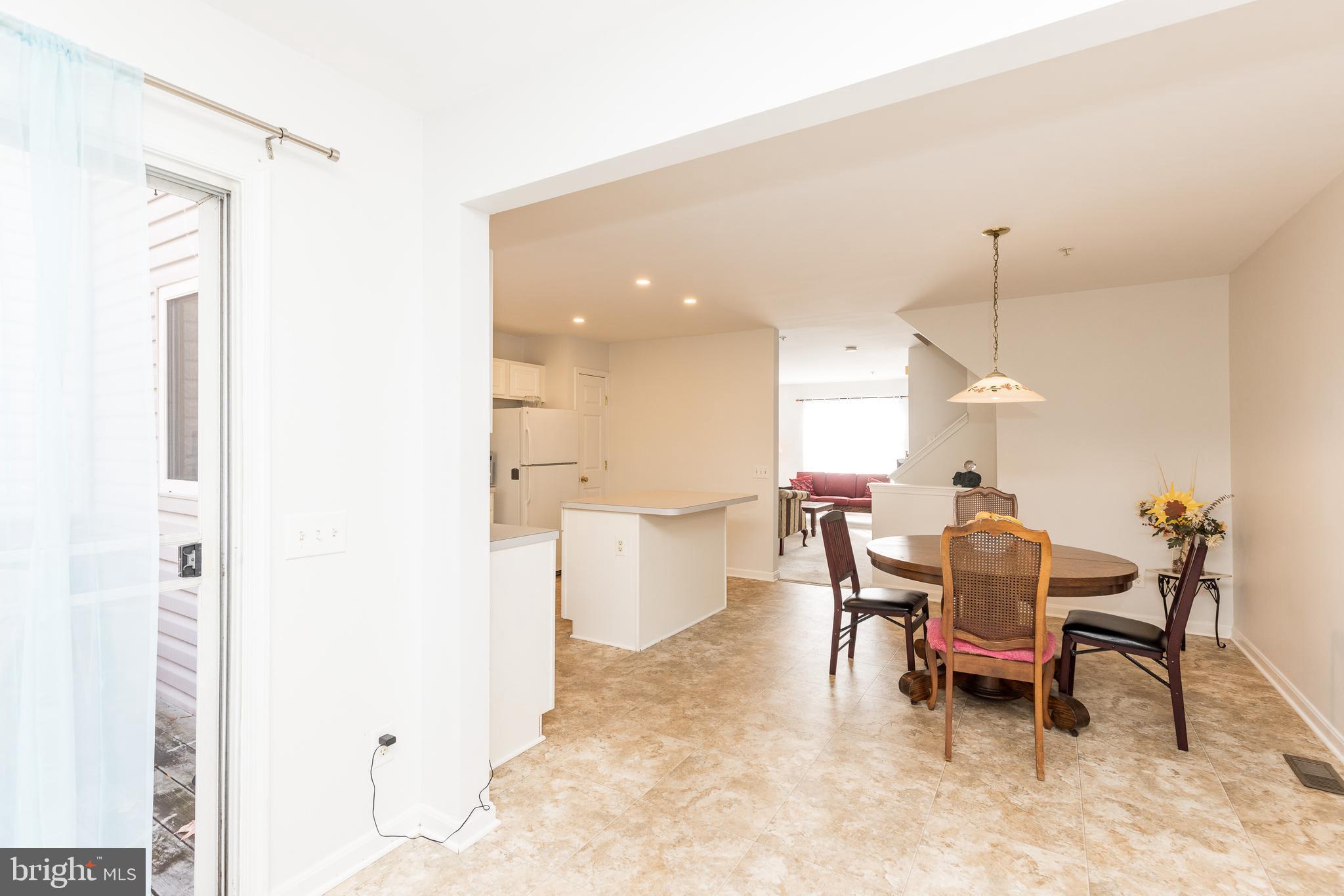 232 Night Haven Court Edgewater, MD 21037 - Photo 8 of 39 a dining room with a table and chairs