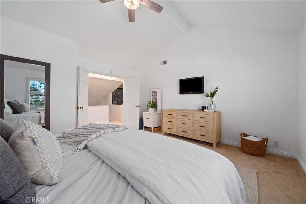 25695 La Cima Laguna Niguel, CA 92677 - Photo 20 of 52 a bedroom with a bed and a flat tv screen on dresser