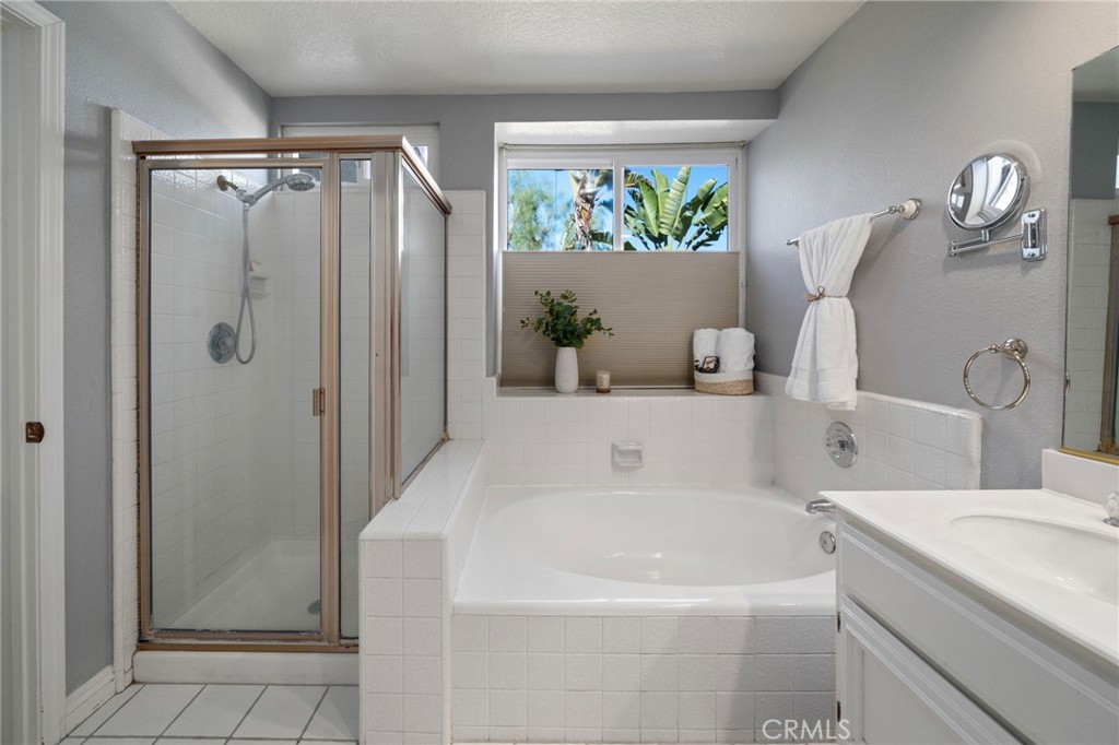 25695 La Cima Laguna Niguel, CA 92677 - Photo 23 of 52 a bathroom with a tub a sink and a shower