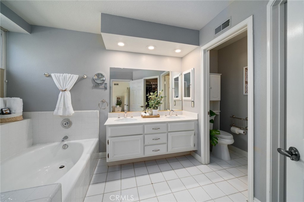 25695 La Cima Laguna Niguel, CA 92677 - Photo 24 of 52 a bathroom with a bathtub sink and toilet