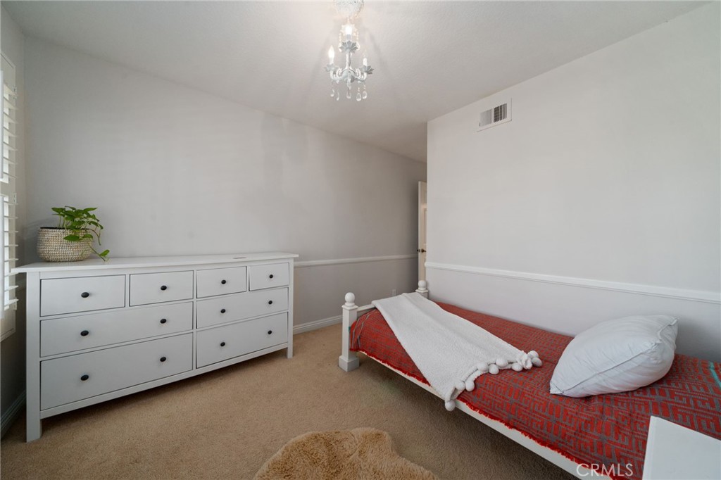 25695 La Cima Laguna Niguel, CA 92677 - Photo 28 of 52 a bed room with a bed and a potted plant