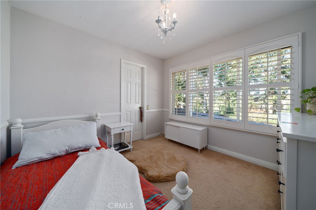 25695 La Cima Laguna Niguel, CA 92677 - Photo 29 of 52 a bedroom with a bed and a large window