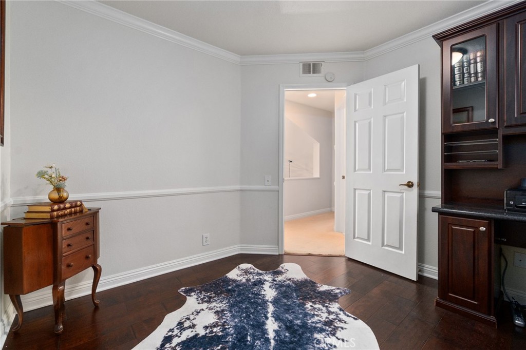 25695 La Cima Laguna Niguel, CA 92677 - Photo 31 of 52 a bedroom with a bed and wooden floor