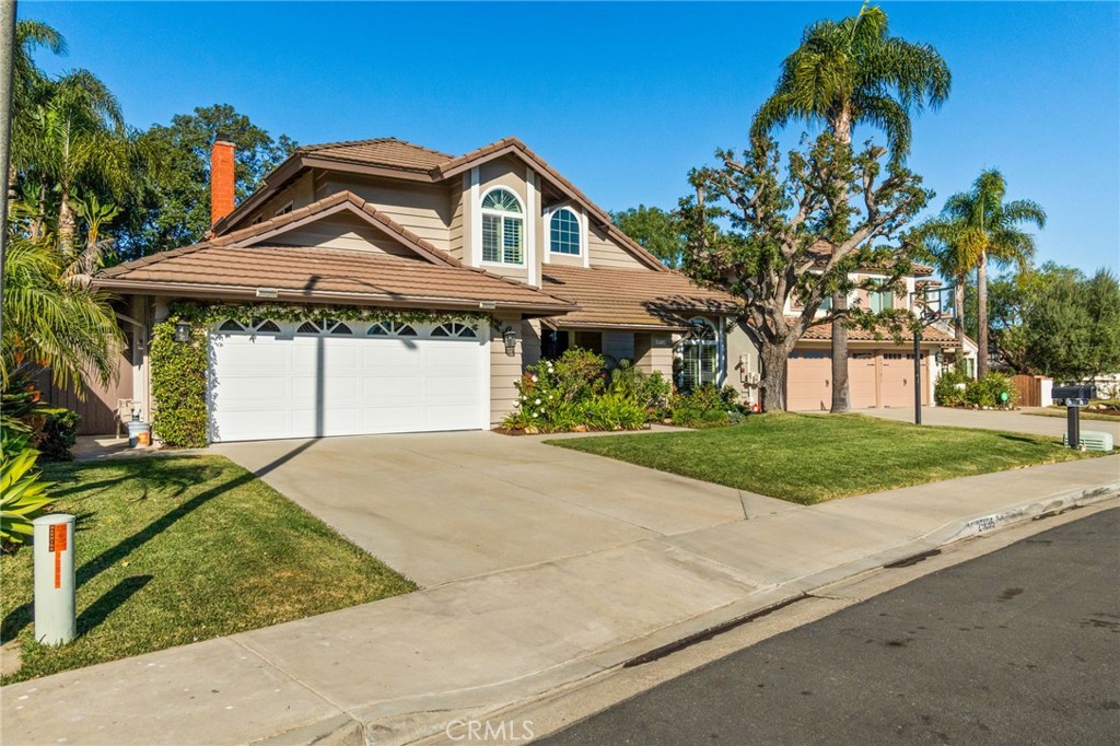 25695 La Cima Laguna Niguel, CA 92677 - Photo 38 of 52 a front view of a house with a yard and garage