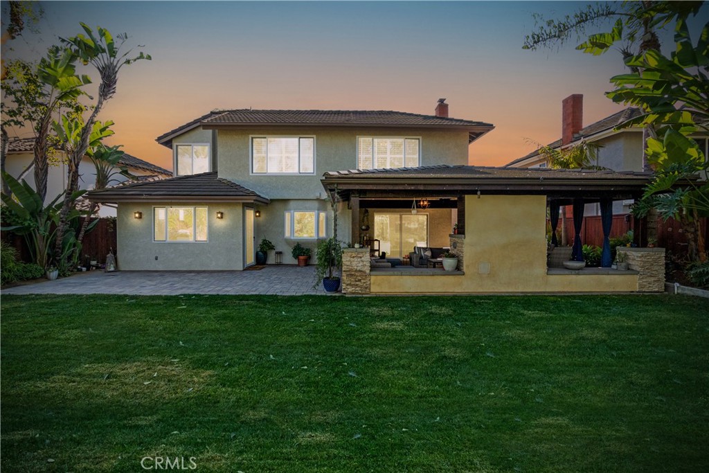 25695 La Cima Laguna Niguel, CA 92677 - Photo 52 of 52 a view of a white house with a big yard and potted plants