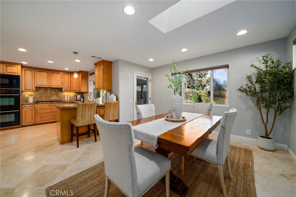 25695 La Cima Laguna Niguel, CA 92677 - Photo 9 of 52 a view of a dining room with furniture and a kitchen