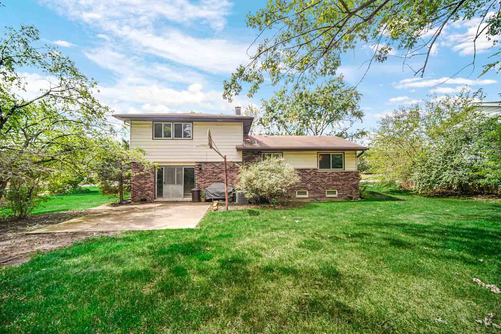 2826 Walnut Road Homewood, IL 60430 - Photo 19 of 20 a front view of a house with a yard and trees