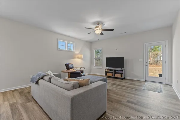a bedroom with a bed and ceiling fan