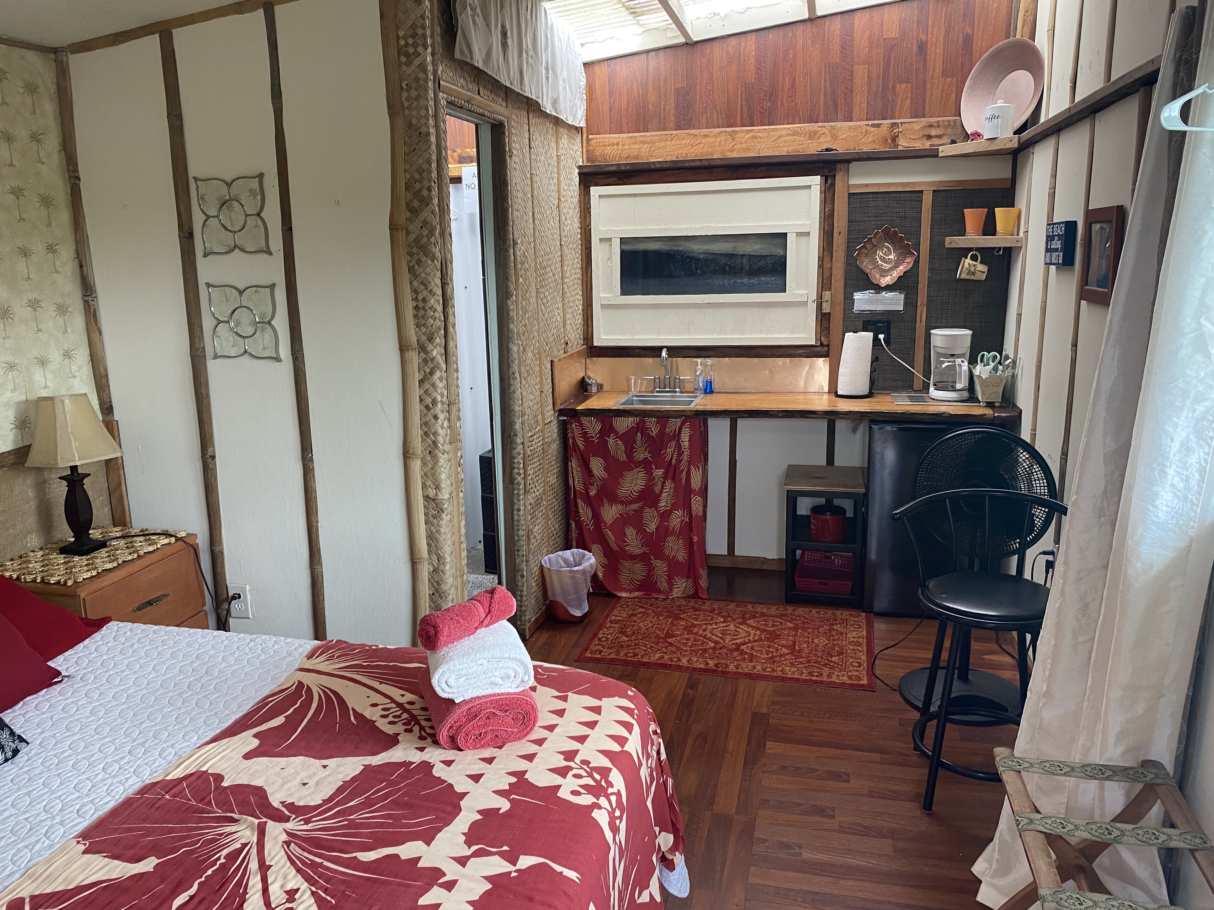 93-2073 South Point Road Captain Cook, HI 96704 - Photo 12 of 19 a bedroom with a bed and dresser with wooden floor