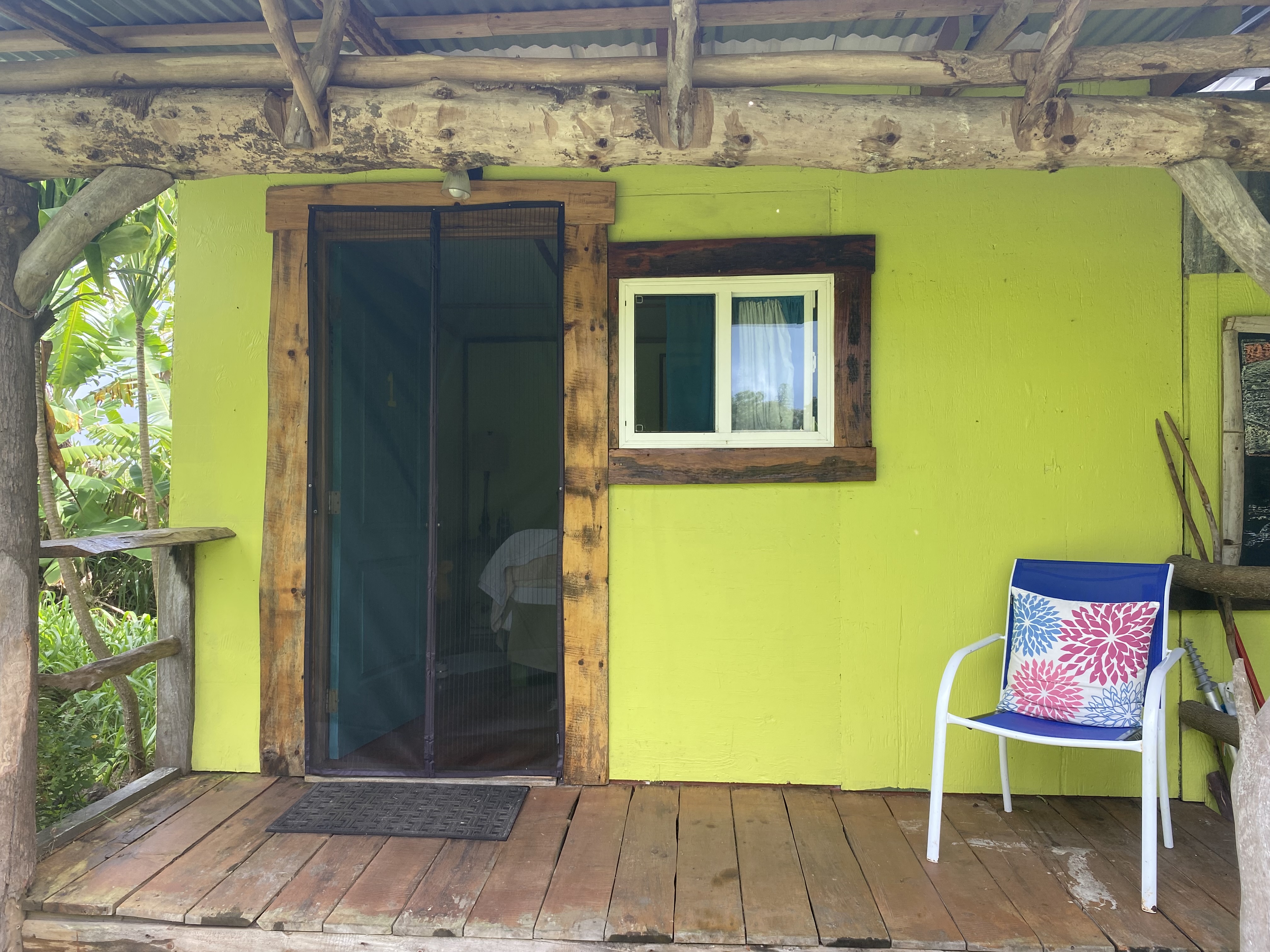 93-2073 South Point Road Captain Cook, HI 96704 - Photo 9 of 19 a front view of a house with a yard and furniture