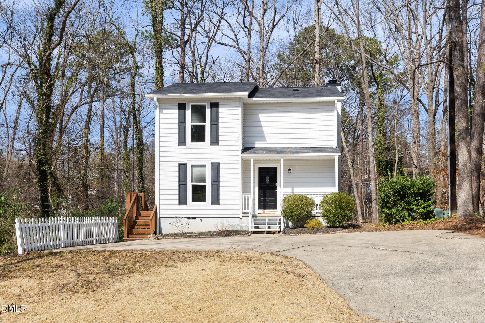 front view of a house with a trees