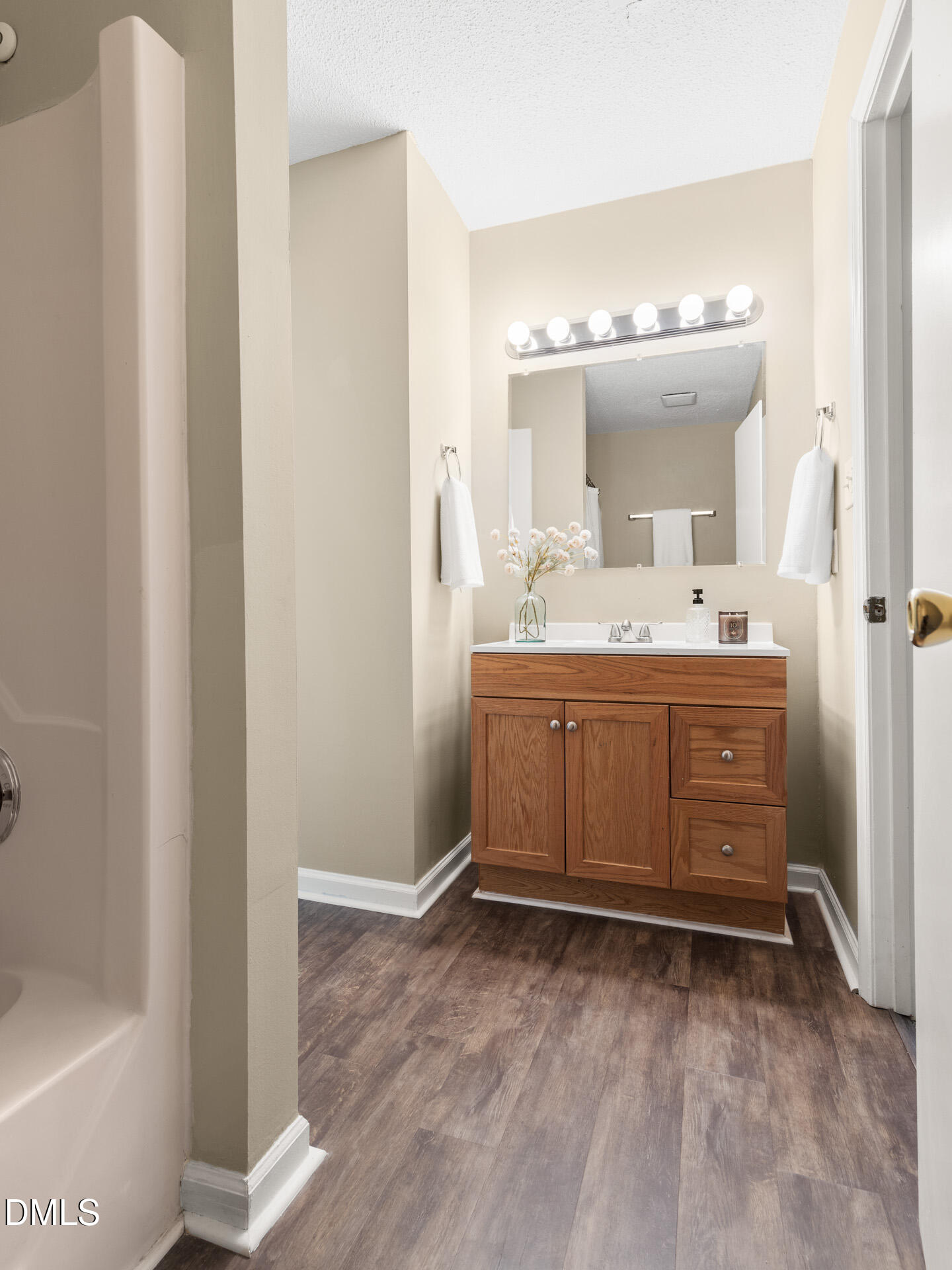1004 Cheviot Avenue Durham, NC 27707 - Photo 28 of 34 a bathroom with a sink and a mirror