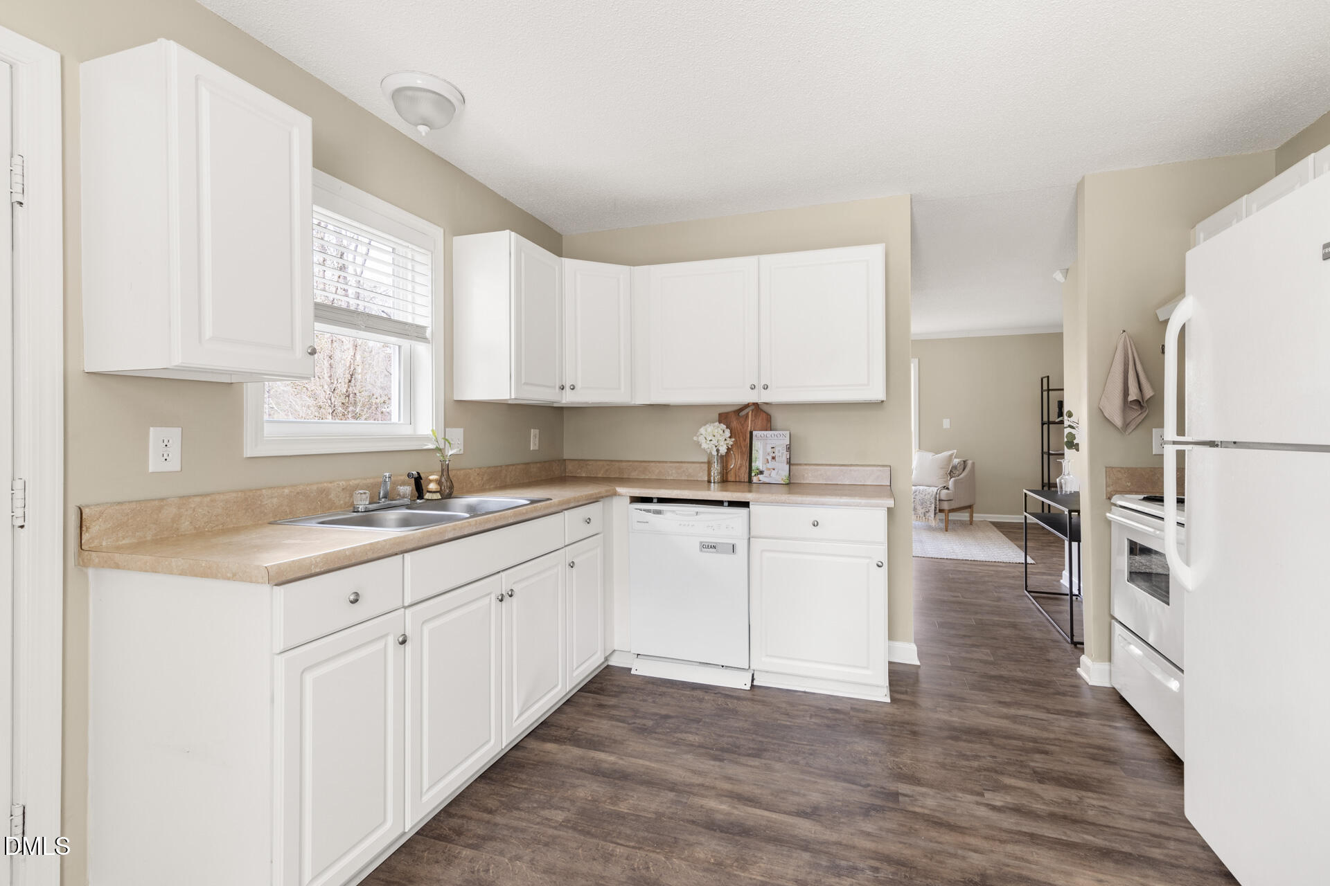 1004 Cheviot Avenue Durham, NC 27707 - Photo 9 of 34 a kitchen that has a lot of white cabinets and wooden floor