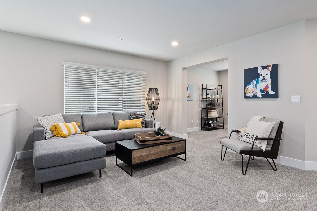 21541 6th Drive Southeast, Unit RM16 Bothell, WA 98021 - Photo 23 of 31 a living room with furniture and a large window