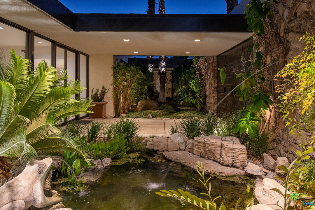 70170 Sonora Road Rancho Mirage, CA 92270 - Photo 32 of 45 a view of swimming pool with outdoor seating and a yard