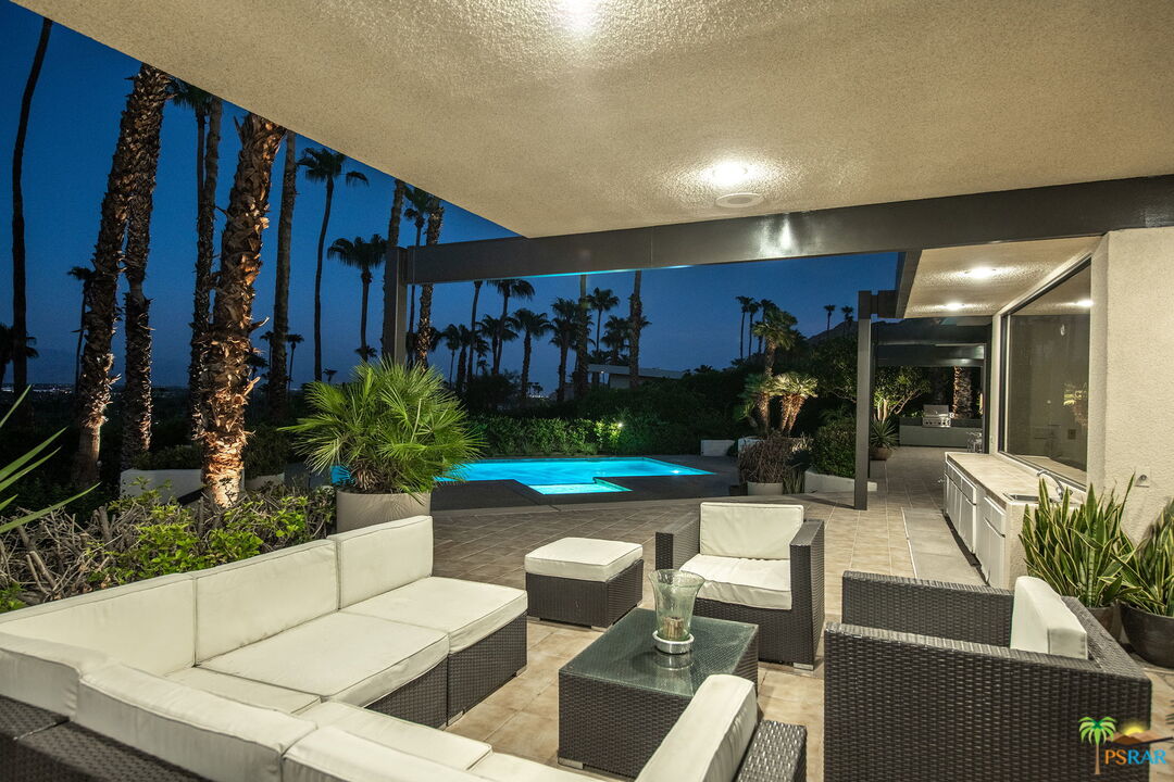 70170 Sonora Road Rancho Mirage, CA 92270 - Photo 34 of 45 a living room with patio furniture and potted plants