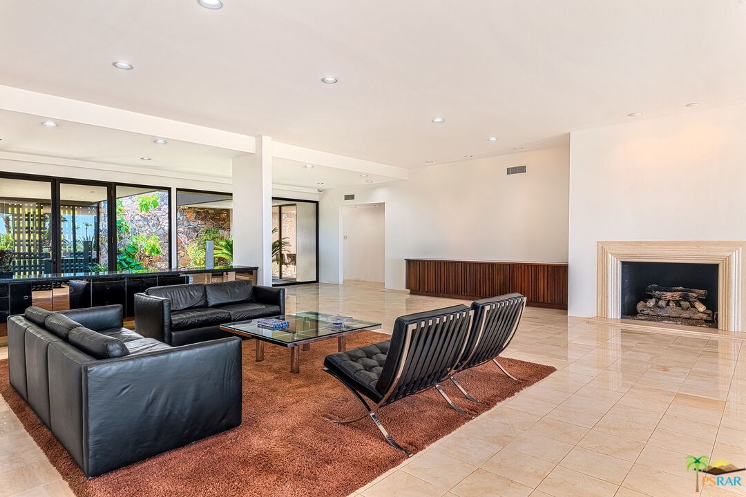 70170 Sonora Road Rancho Mirage, CA 92270 - Photo 9 of 45 a living room with furniture and a fireplace